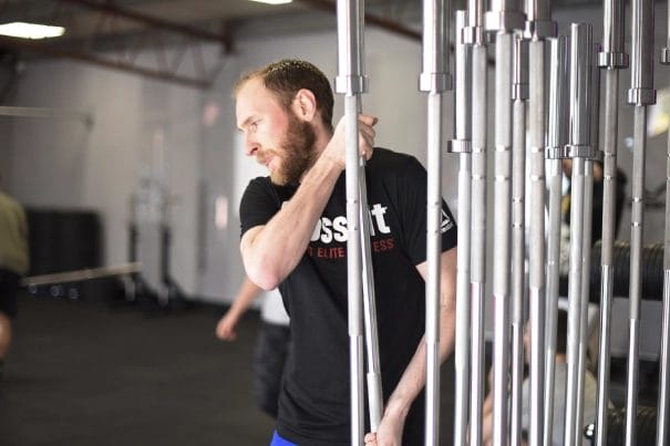 man with weight bar